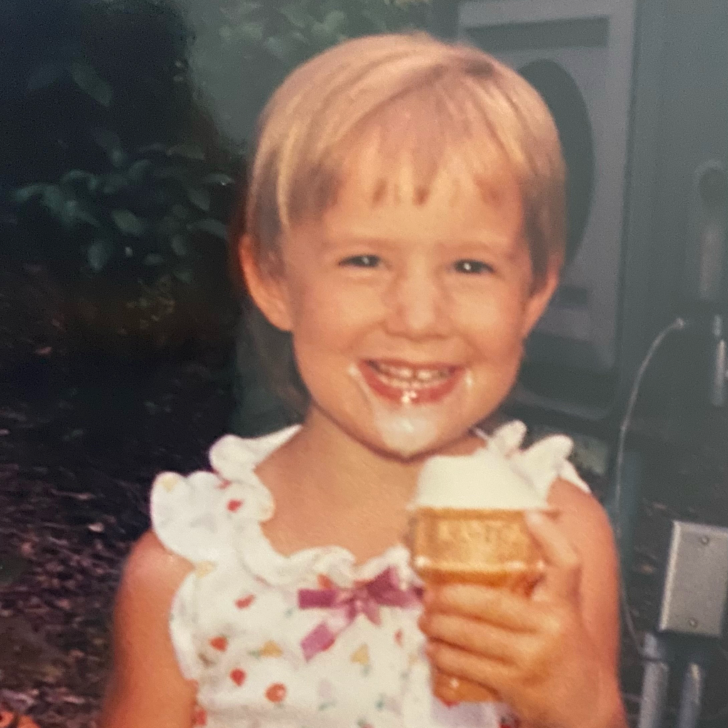 HoliBlogger Jamie eating ice cream at the park as a child