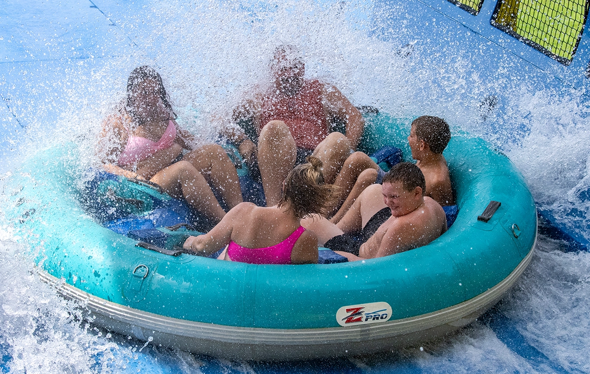 A group of riders gets splashed while riding Mammoth Water Coaster at Holiday World & Splashin' Safari in Santa Claus, Indiana
