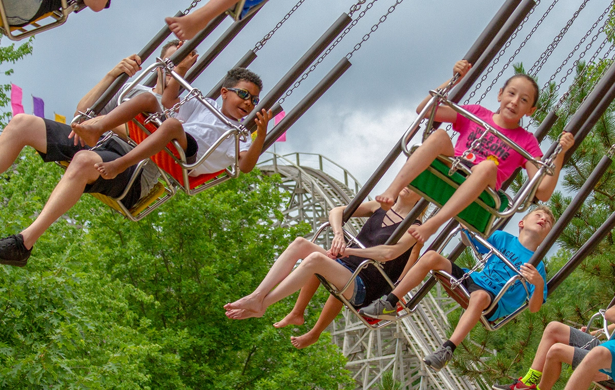 Kids swinging wide on HallowSwings at Holiday World & Splashin' Safari in Santa Claus, Indiana.