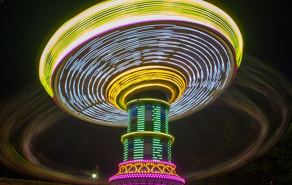 Night time long exposure showing light trails of HallowSwing's lighting package at Holiday World & Splashin' Safari in Santa Claus, Indiana.