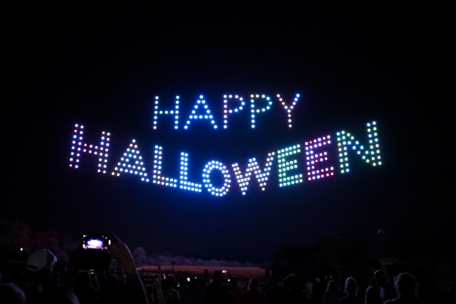 The words "Happy Halloween" made of drones during Halloween in the Sky at Holiday World.