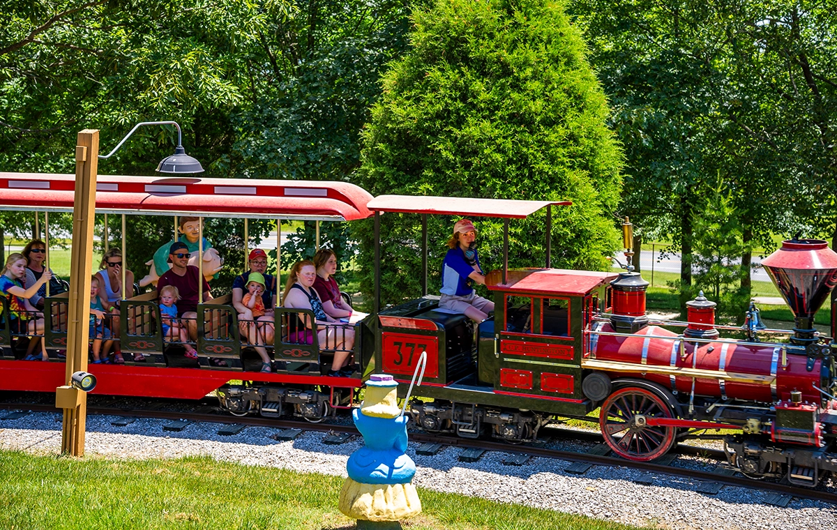 Holidog Express passes by the statue of Little Bo Peep at Holiday World & Splashin' Safari in Santa Claus, Indiana.