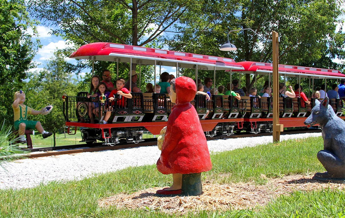 Riders look at Little Red Riding hood as they go by on Holidog Express at Holiday World & Splashin' Safari in Santa Claus, Indiana.