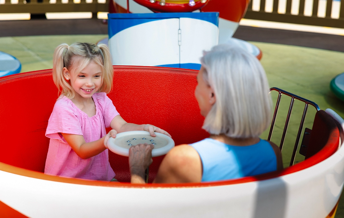 A young girl and grandmother smile on Kitty's Tea Party at Holiday World & Splashin' Safari in Santa Claus, Indiana.