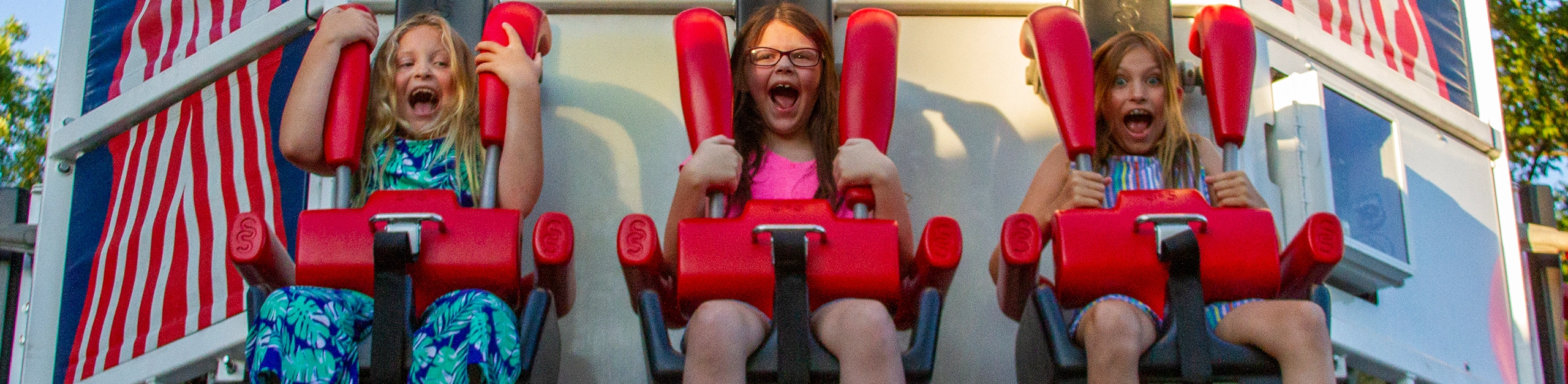 Three young girls screaming on Liberty Launch at Holiday World & Splashin' Safari in Santa Claus, Indiana.