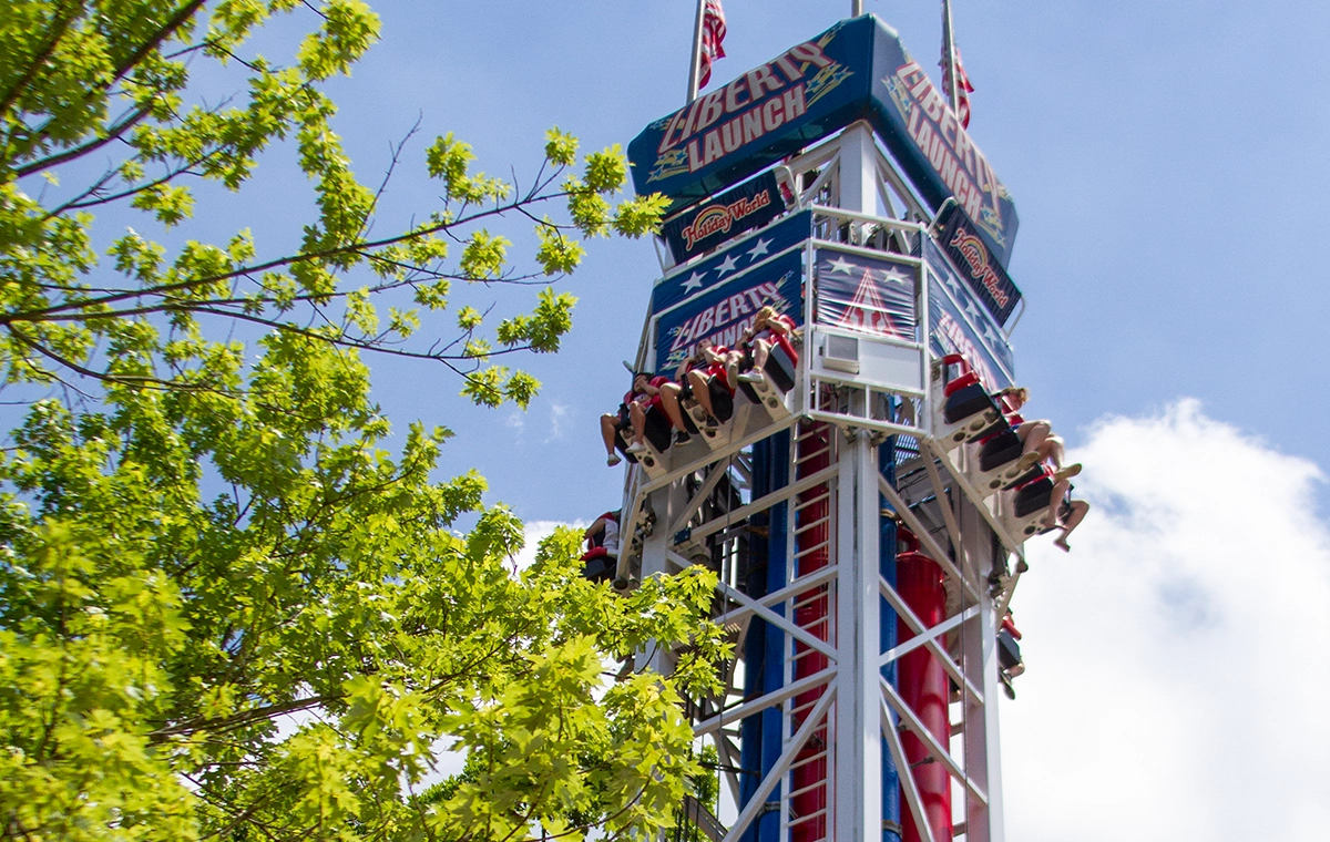 A view of the top of Liberty Launch through the trees at Holiday World & Splashin' Safari in Santa Claus, Indiana.