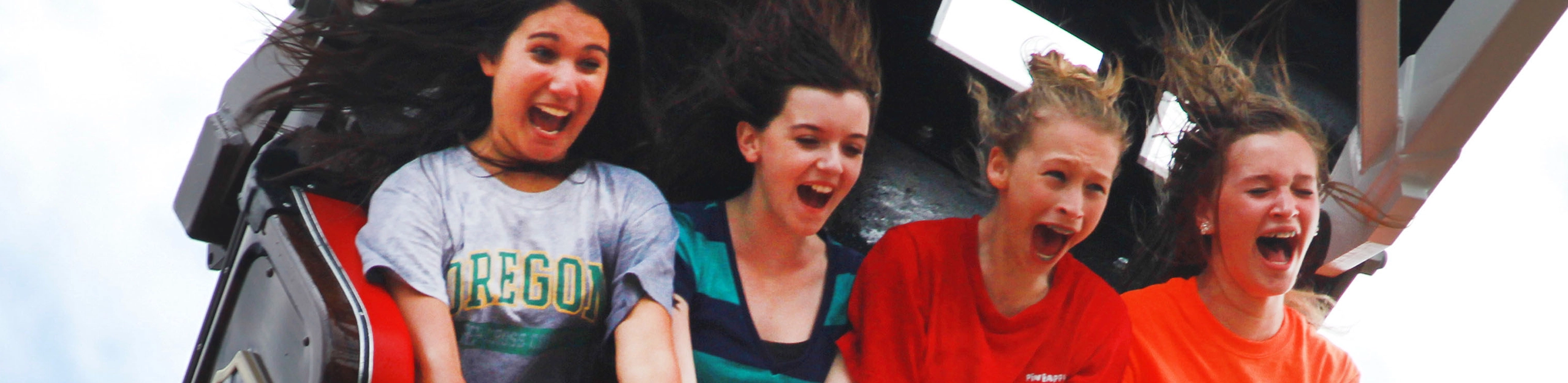 Four teenage girls scream at the top of the swing of Mayflower at Holiday World & Splashin' Safari in Santa Claus, Indiana.