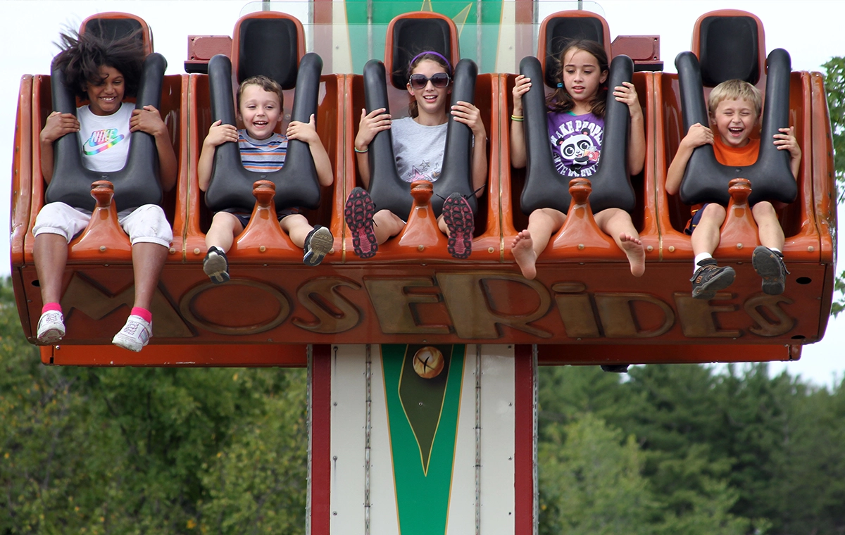 Children share smiles, scares, and crazy hair on Reindeer Games at Holiday World & Splashin' Safari in Santa Claus, Indiana.