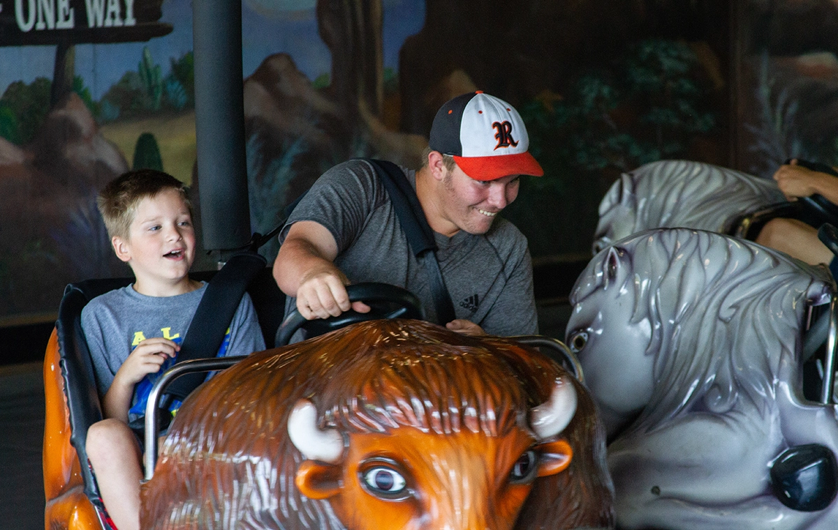 A father and son go full bore in their buffalo on Rough Riders at Holiday World & Splashin' Safari in Santa Claus, Indiana.