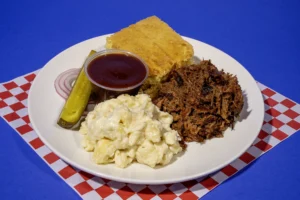 Plate Meal of Pulled Pork with Pepper Jack Mac & Cheese and Cornbread from Sam's Smokehouse at Holiday World & Splashin' Safari.