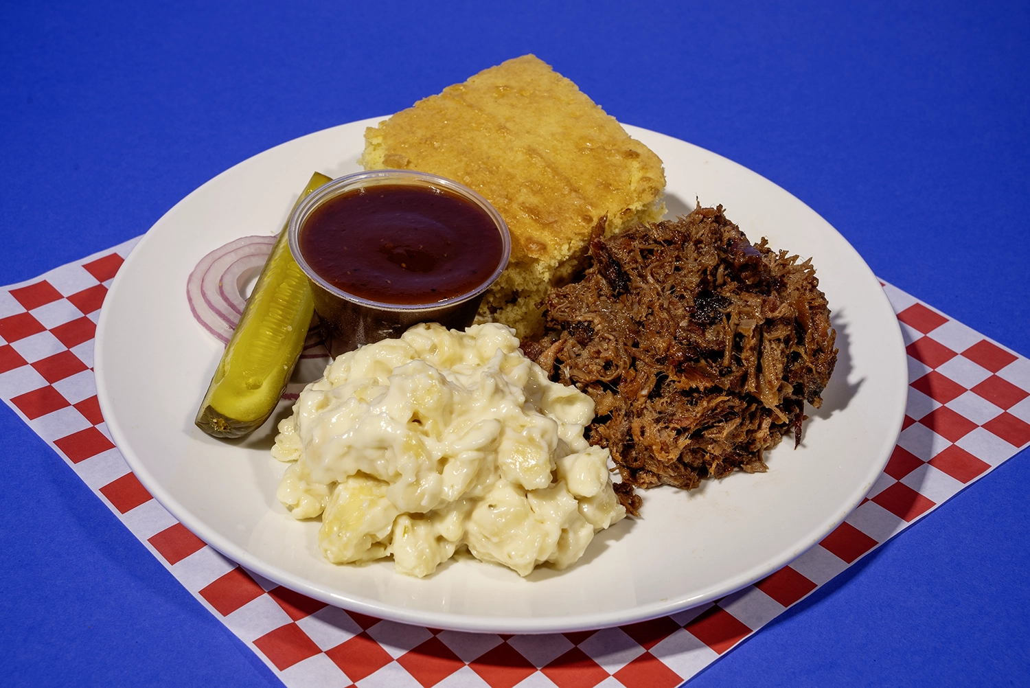 Plate Meal of Pulled Pork with Pepper Jack Mac & Cheese and Cornbread from Sam's Smokehouse at Holiday World & Splashin' Safari.