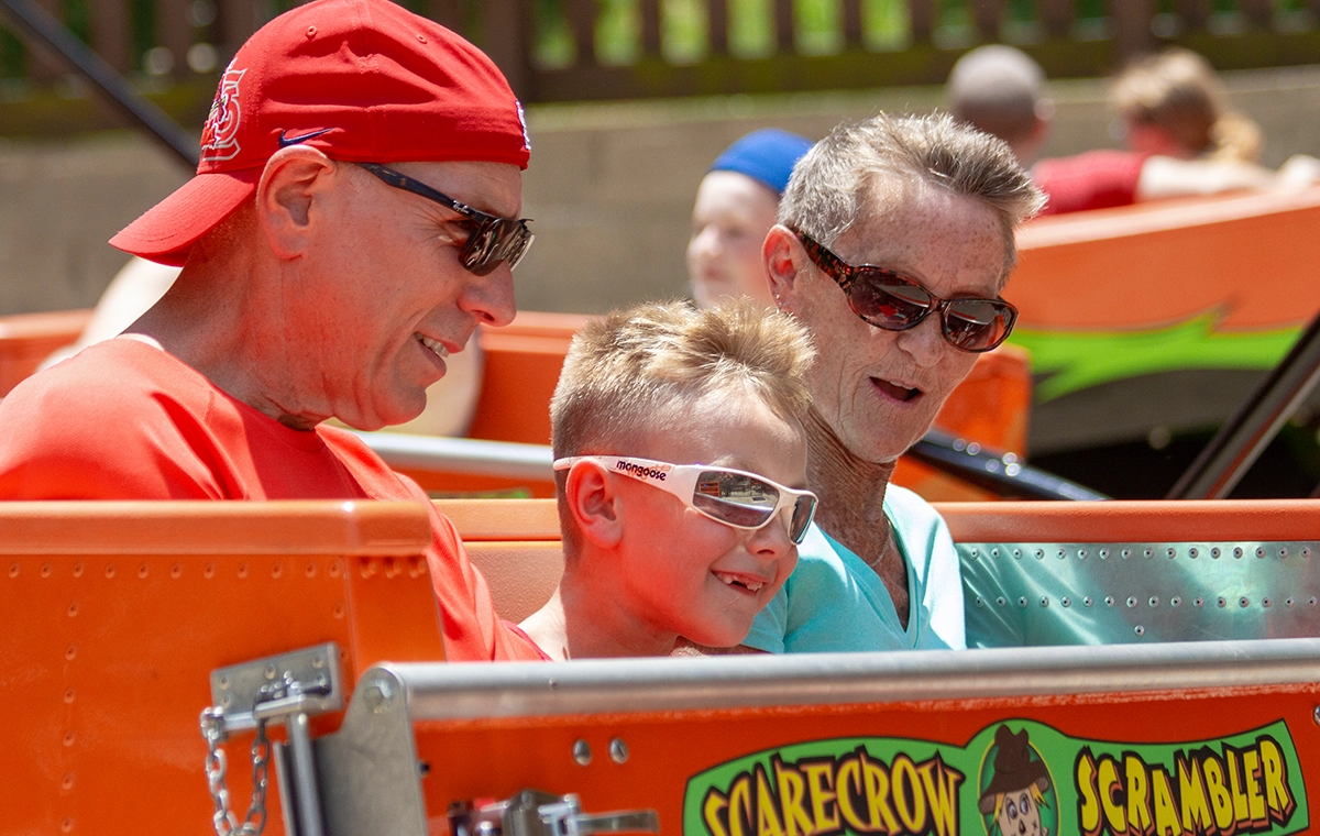 Three generations riding together on Scarecrow Scrambler at Holiday World & Splashin' Safari in Santa Claus, Indiana.