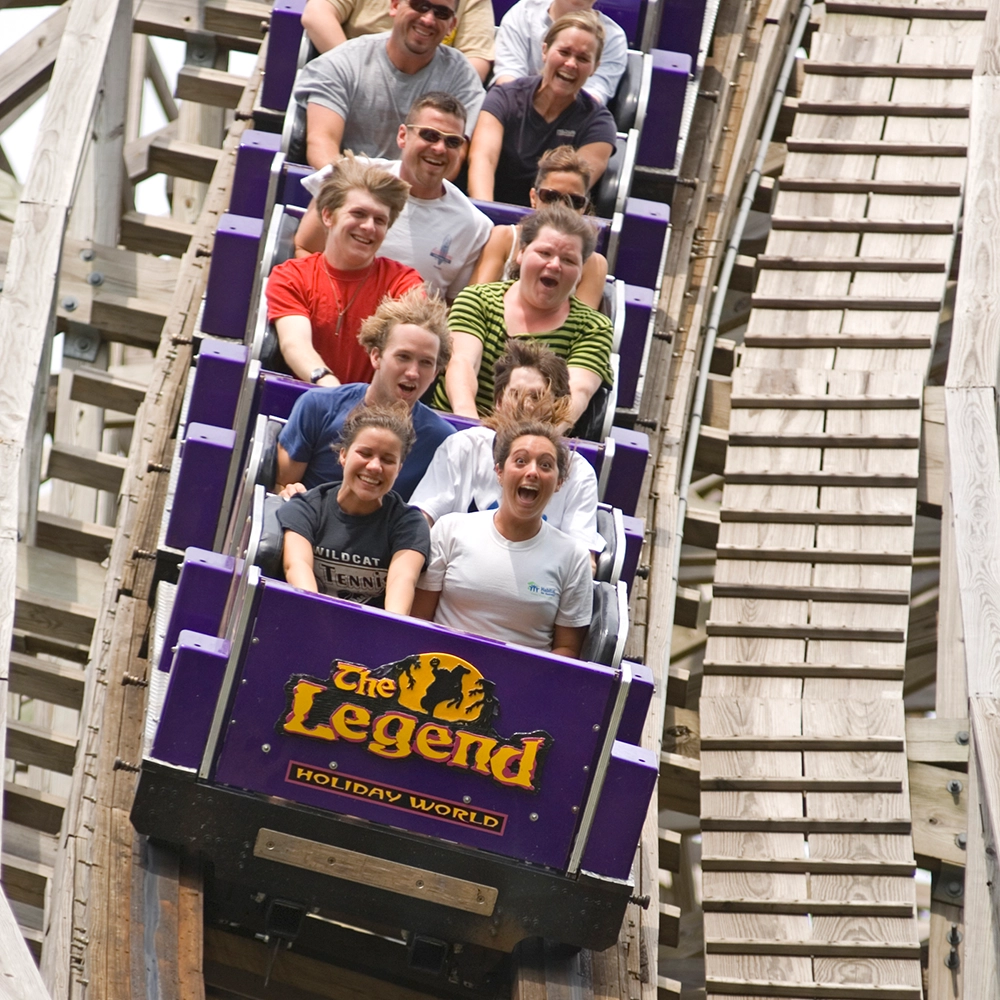 Riders scream while riding downhill on The Legend Wooden Roller Coaster at Holiday World & Splashin' Safari in Santa Claus, Indiana.