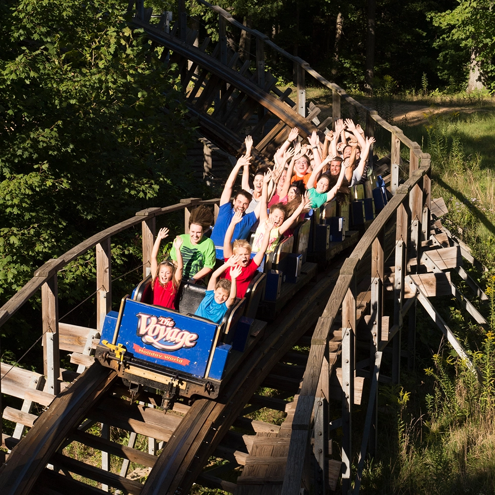 A train races along the twisting track on The Voyage Wooden Roller Coaster at Holiday World & Splashin' Safari in Santa Claus, Indiana