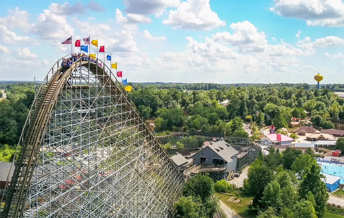 Aerial photo of The Voyage Wooden Roller Coaster that includes The Wave and the iconic Water Tower at Holiday World & Splashin' Safari in Santa Claus, Indiana