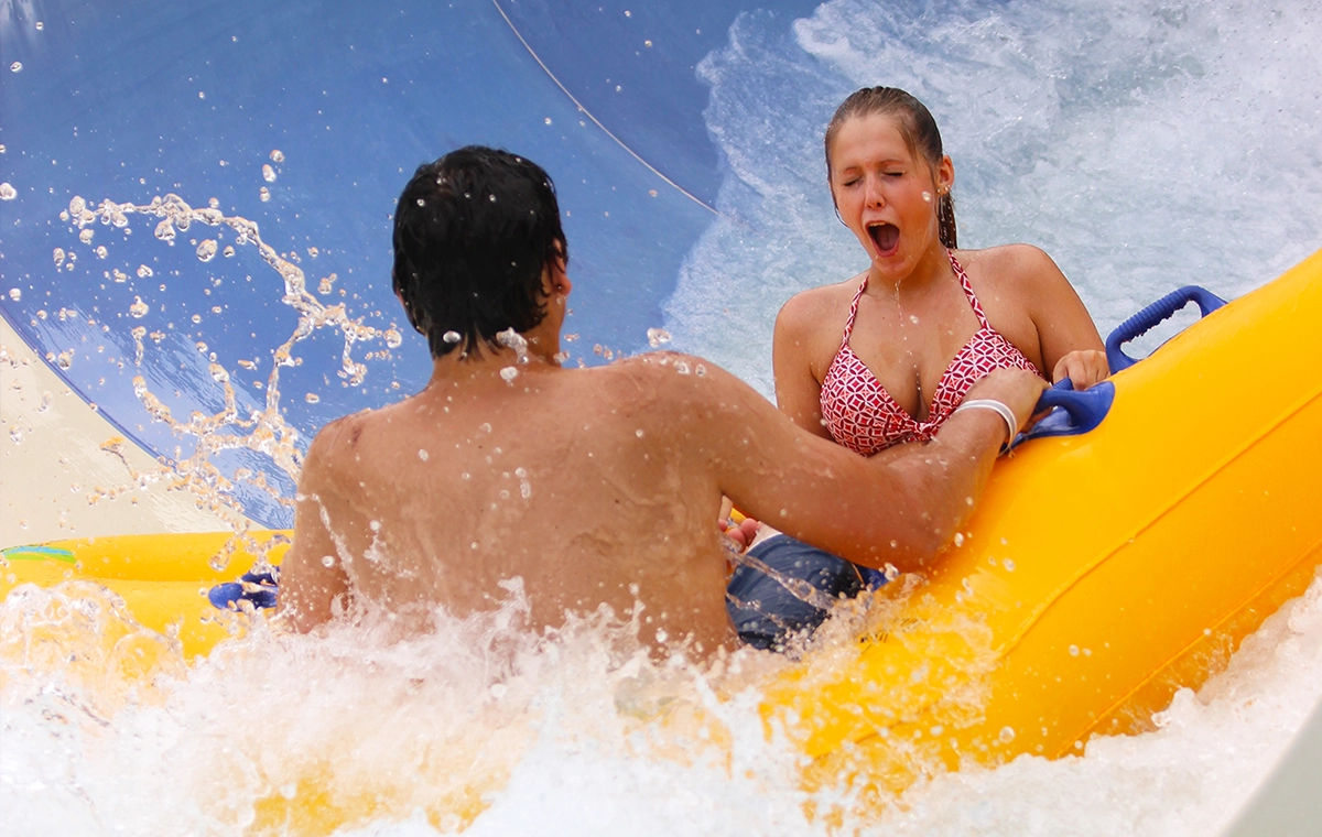 A couple hits the splash down pool on ZOOMbabwe at Holiday World & Splashin' Safari in Santa Claus, Indiana.
