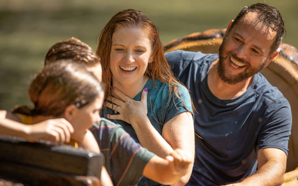 Mom looks like she's catching her breath as she rides Frightful Falls with her family at Holiday World & Splashin' Safari in Santa Claus, Indiana.