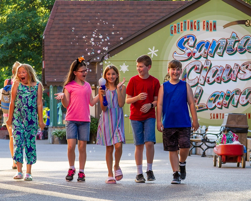 Children walk down the midway together during Kids World at Holiday World.