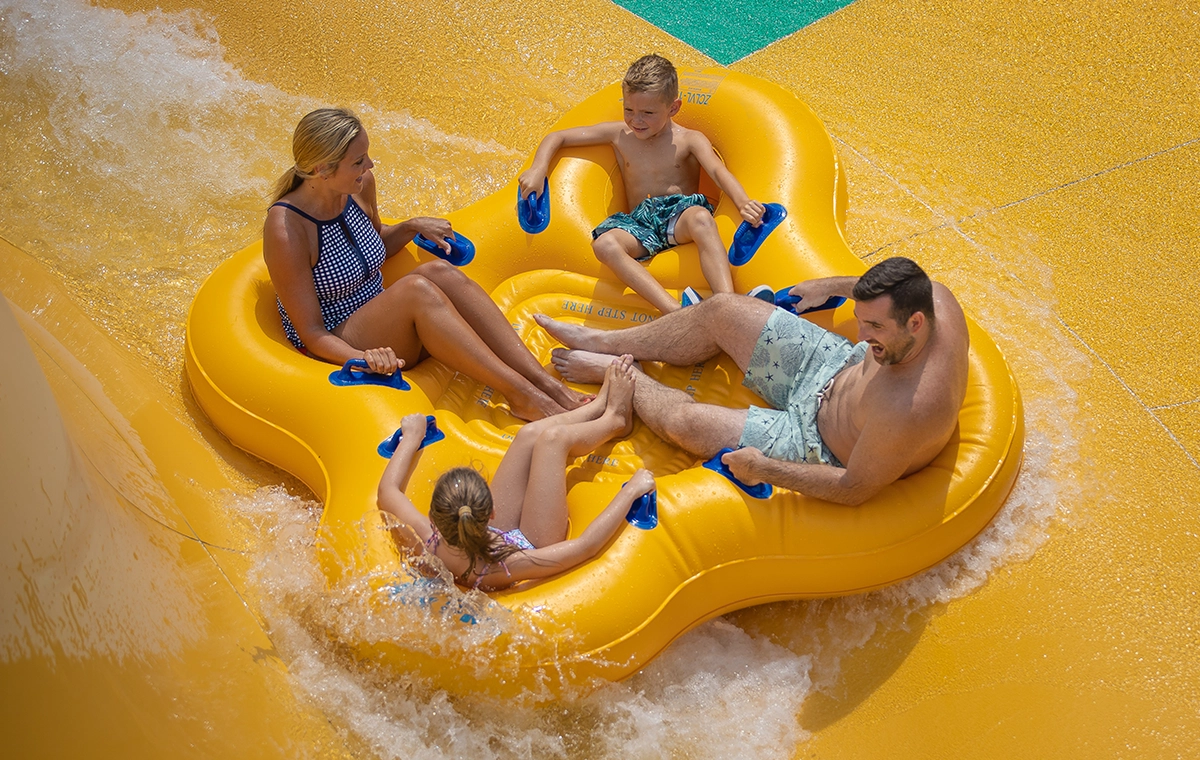 A family slides around the bowl of Bakuli water slide at Holiday World & Splashin' Safari in Santa Claus, Indiana.
