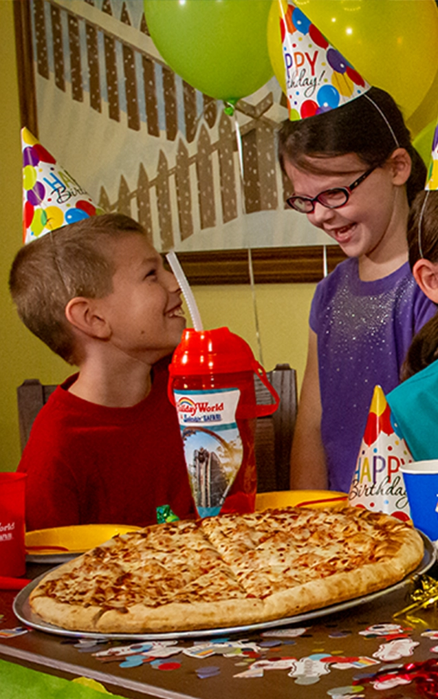 Children celebrating a birthday with a Pizza Party in a private Party Room.