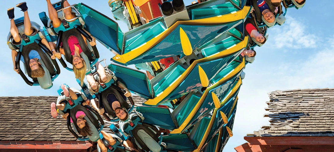 Thunderbird twisting upside down through the fly-through barn at Holiday World.