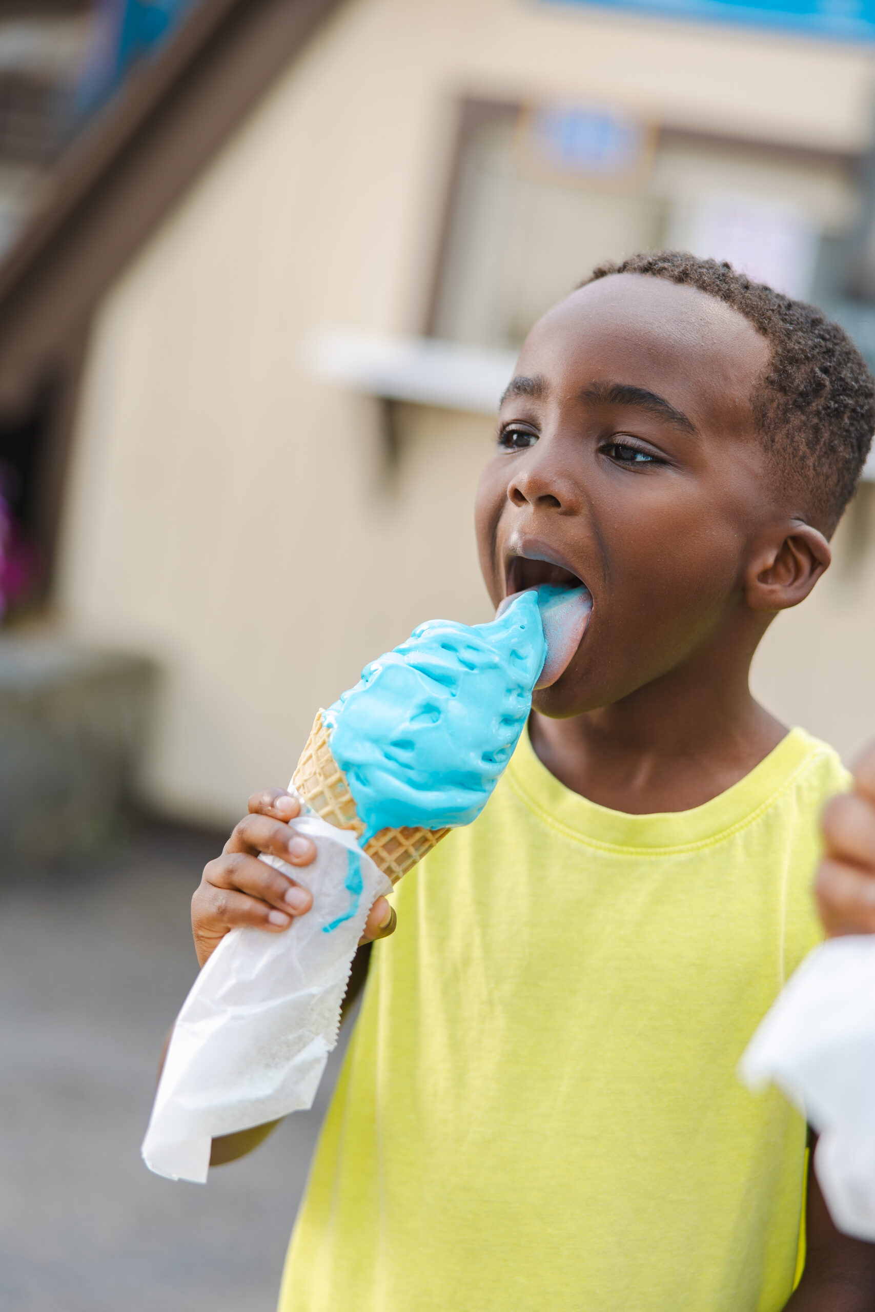 Boy eating Udderly Blue Ice Cream at Holiday World & Splashin' Safari in Santa Claus, Indiana.