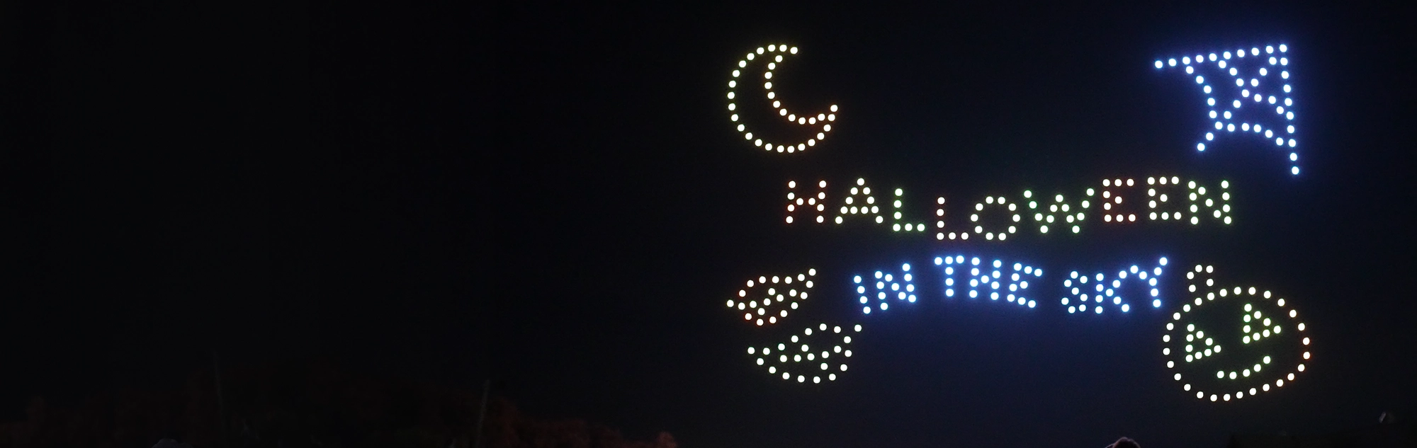 Drones spelling out "Halloween in the Sky" at Holiday World.