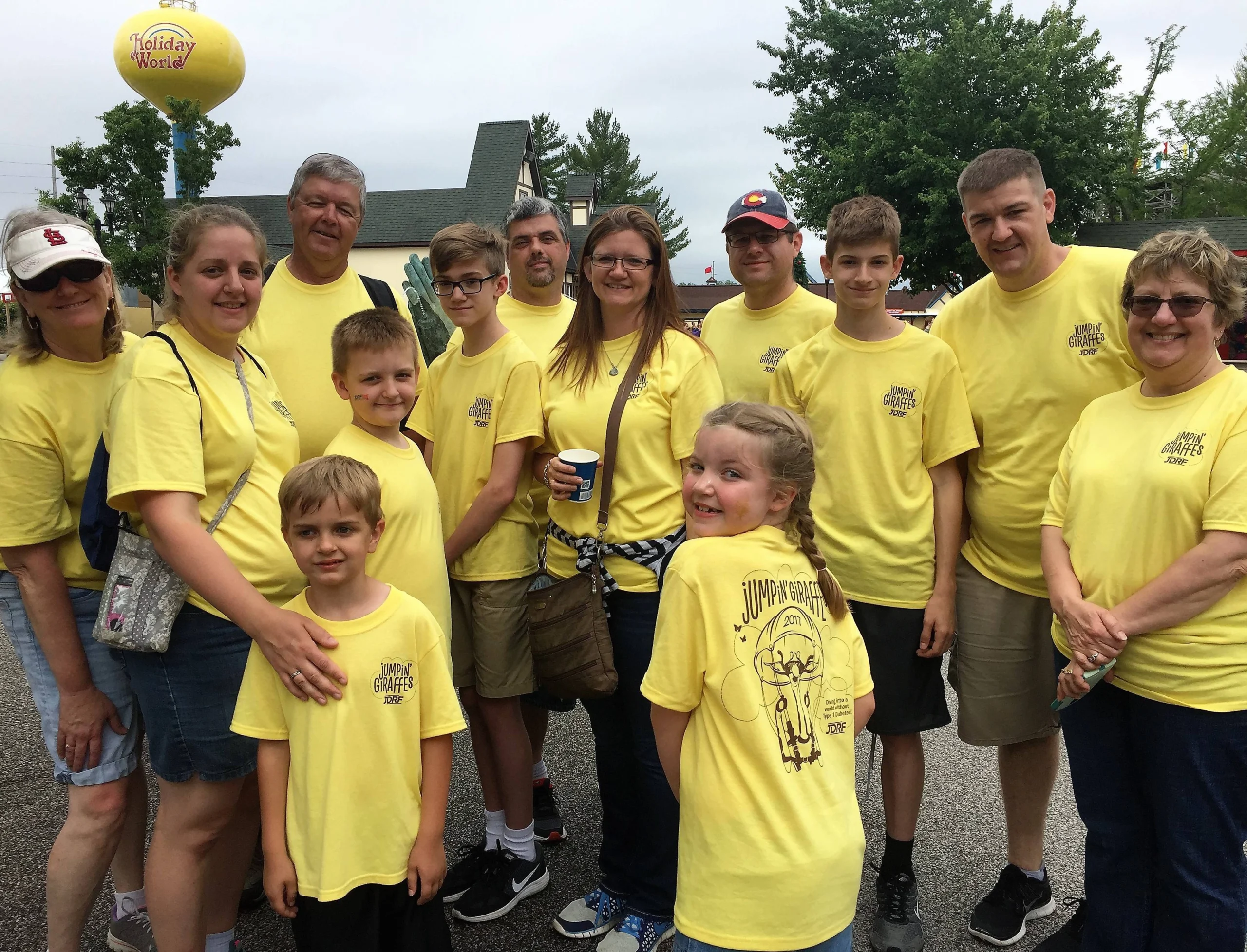 A group shows off their team shirts during the JDRF "One Walk" at Holiday World.