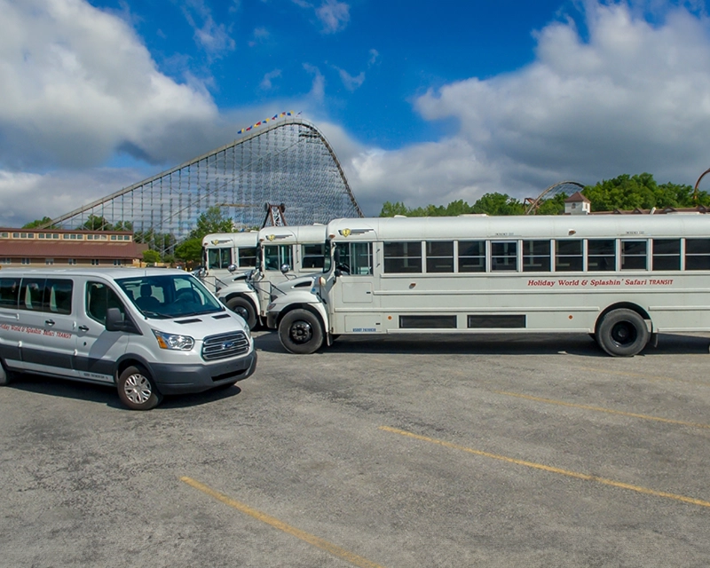 Holiday World & Splashin' Safari Team Member transportation. Photo of a white van and school bus.