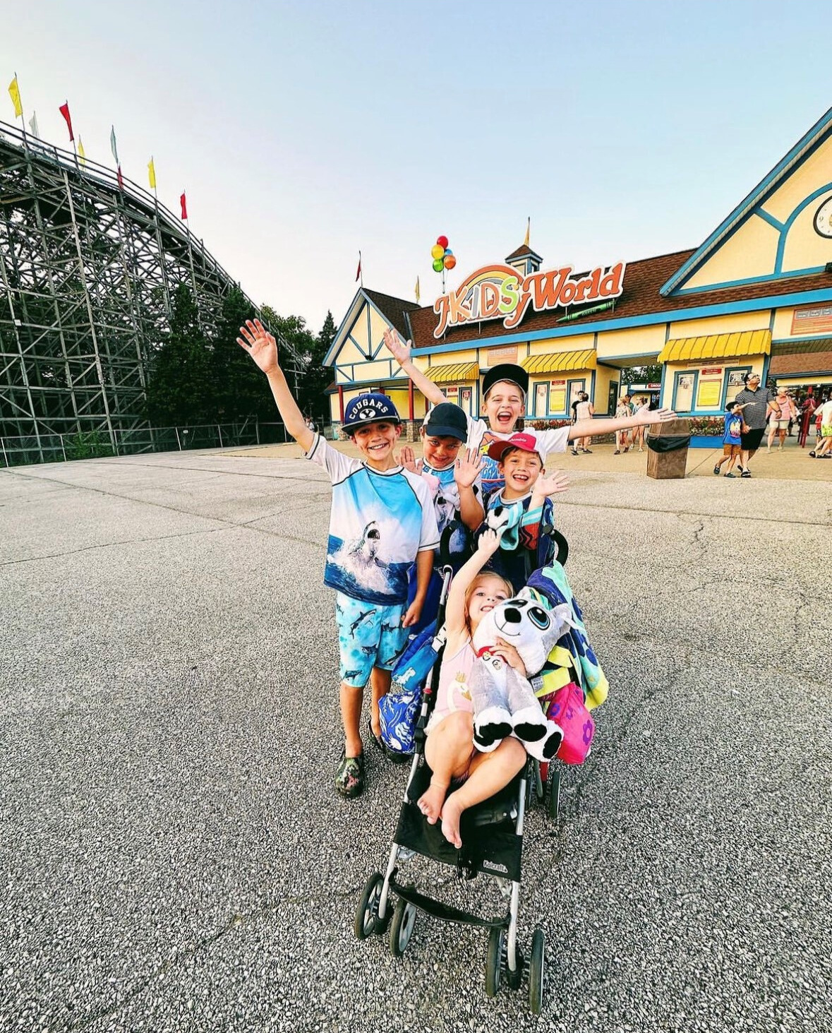 Children take a group photo in front of the Holiday World entrance.