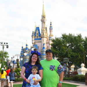 HoliBlogger Alli and her family in front of Cinderella's castle in the Magic Kingdom