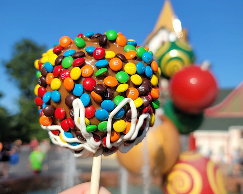 M&M Dipped Apple available at Candy Cane Confectionary.