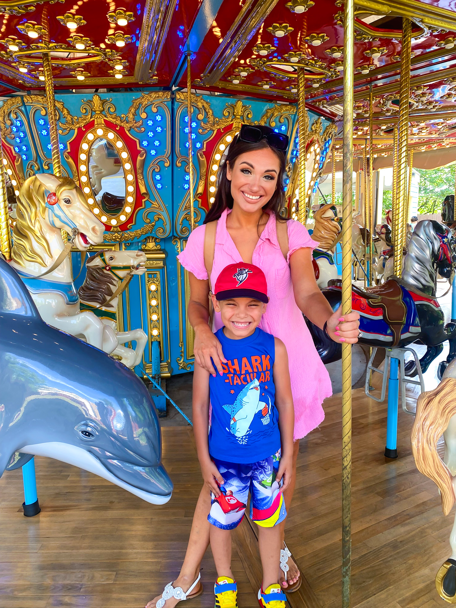 HoliBlogger Nicollette with her son on Star Spangled Carousel