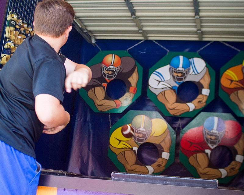 A Guest tosses a tight spiral playing Quarterback Challenge at Holiday World.