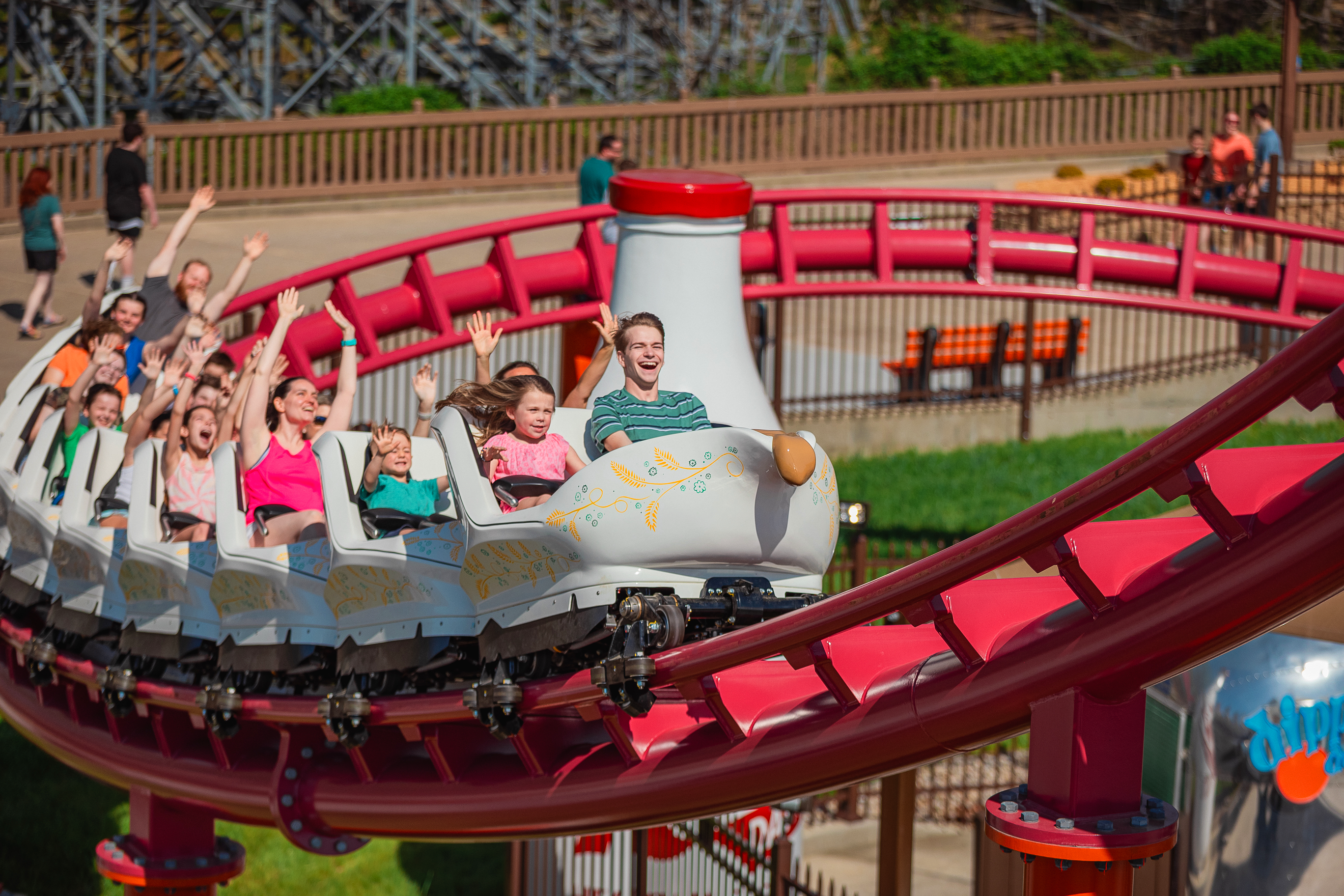 Riders approaching the final spike on Good Gravy! family coaster.