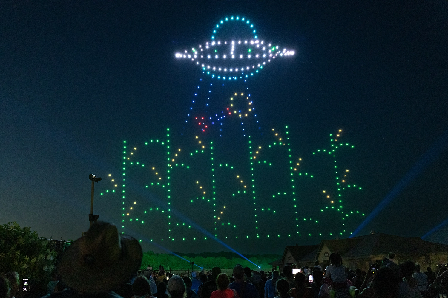 A UFO beams up the Holiday World Water Tower during Holidays in the Sky 2024.