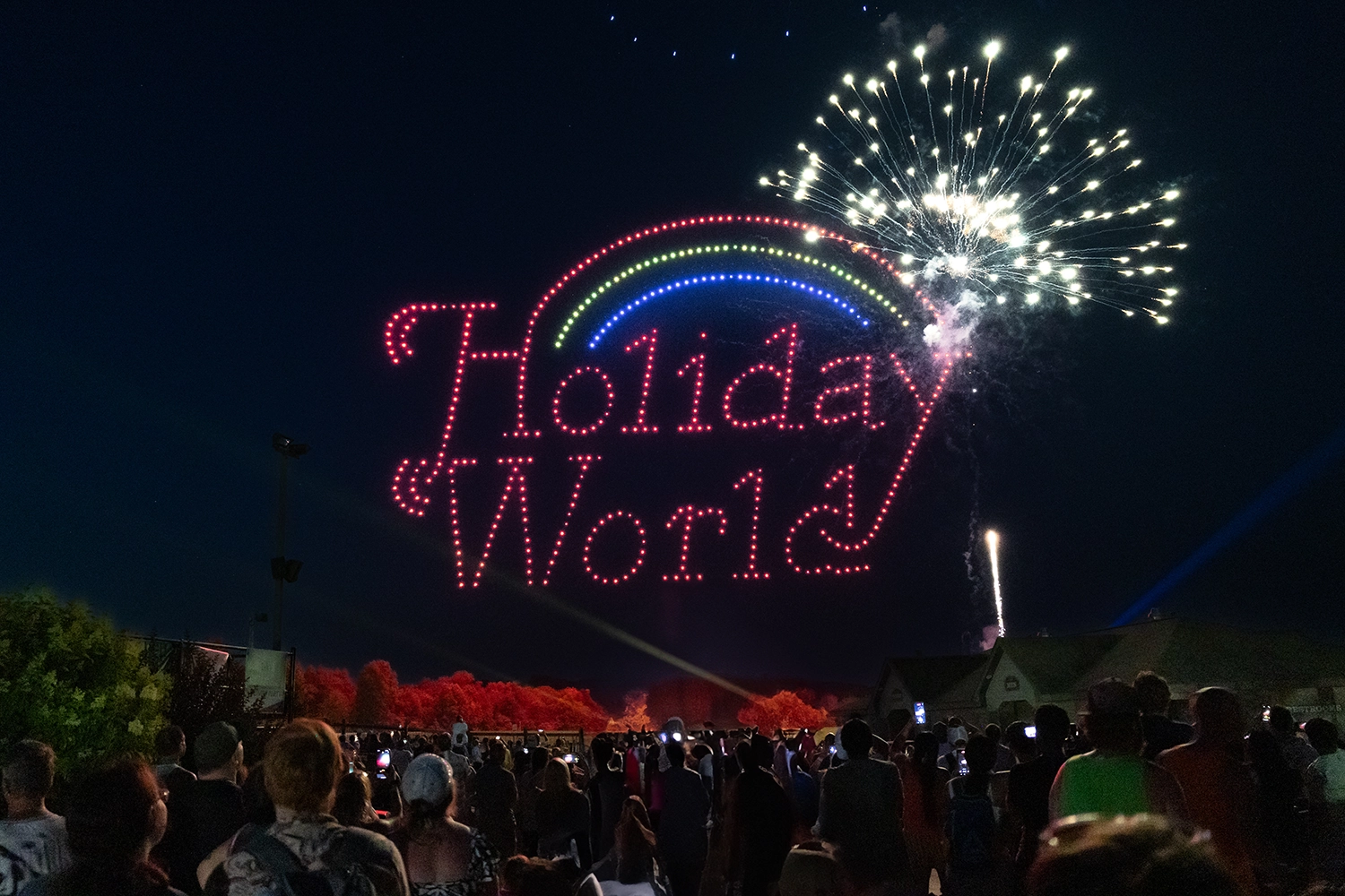 The Holiday World logo behind fireworks during Holidays in the Sky 2024.