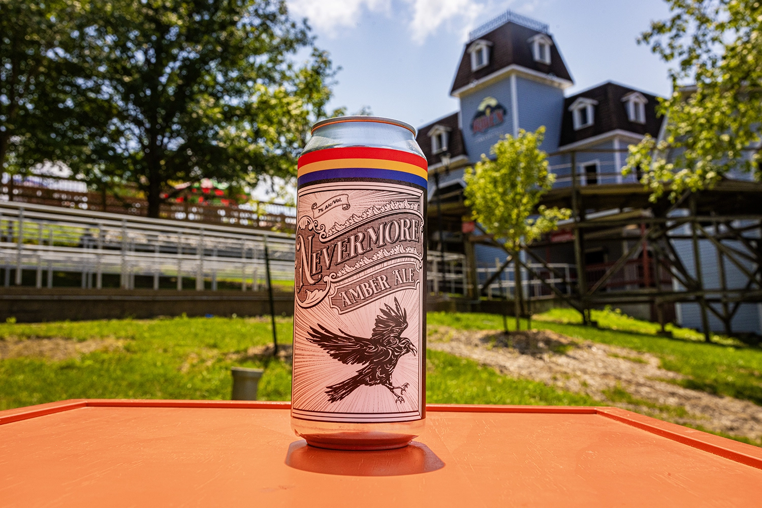 A can of custom-brewed Nevermore Amber Ale in front of The Raven.