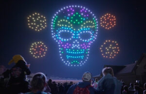 A drone formation during Halloween in the sky that features a decorative skull.