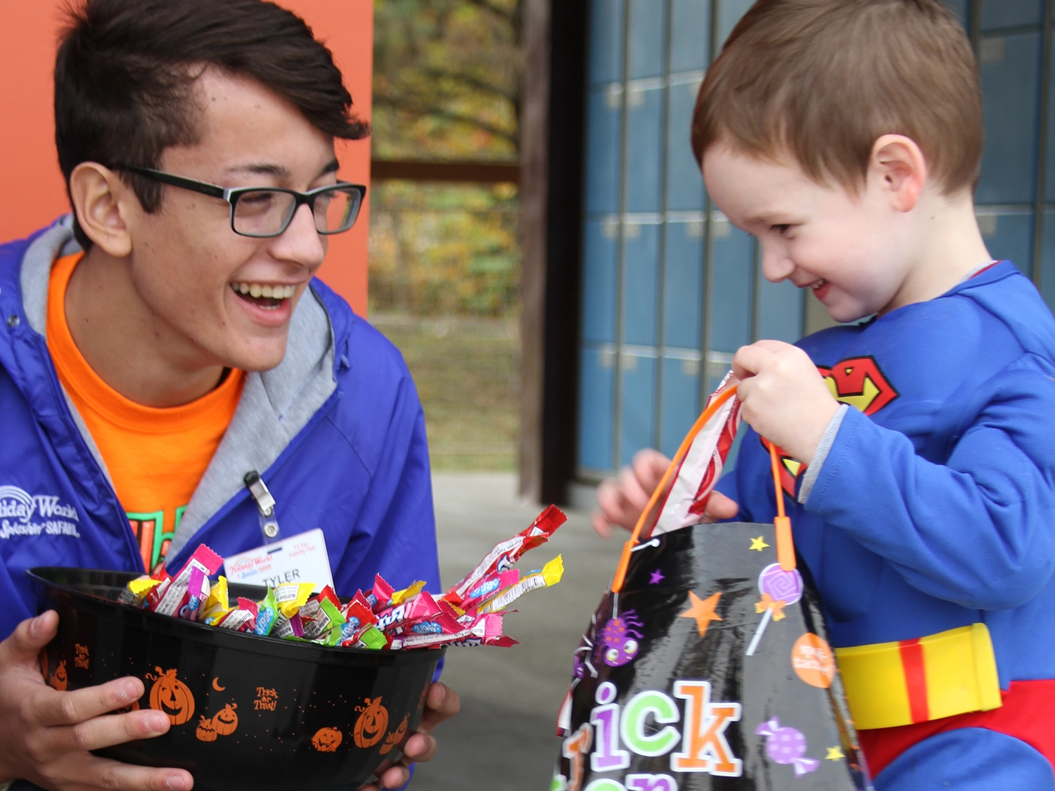 A child receiving candy during the Trick or Treat Trail at Holiday World during Happy Halloween Weekends.